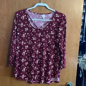 Burgundy top with white flowers.